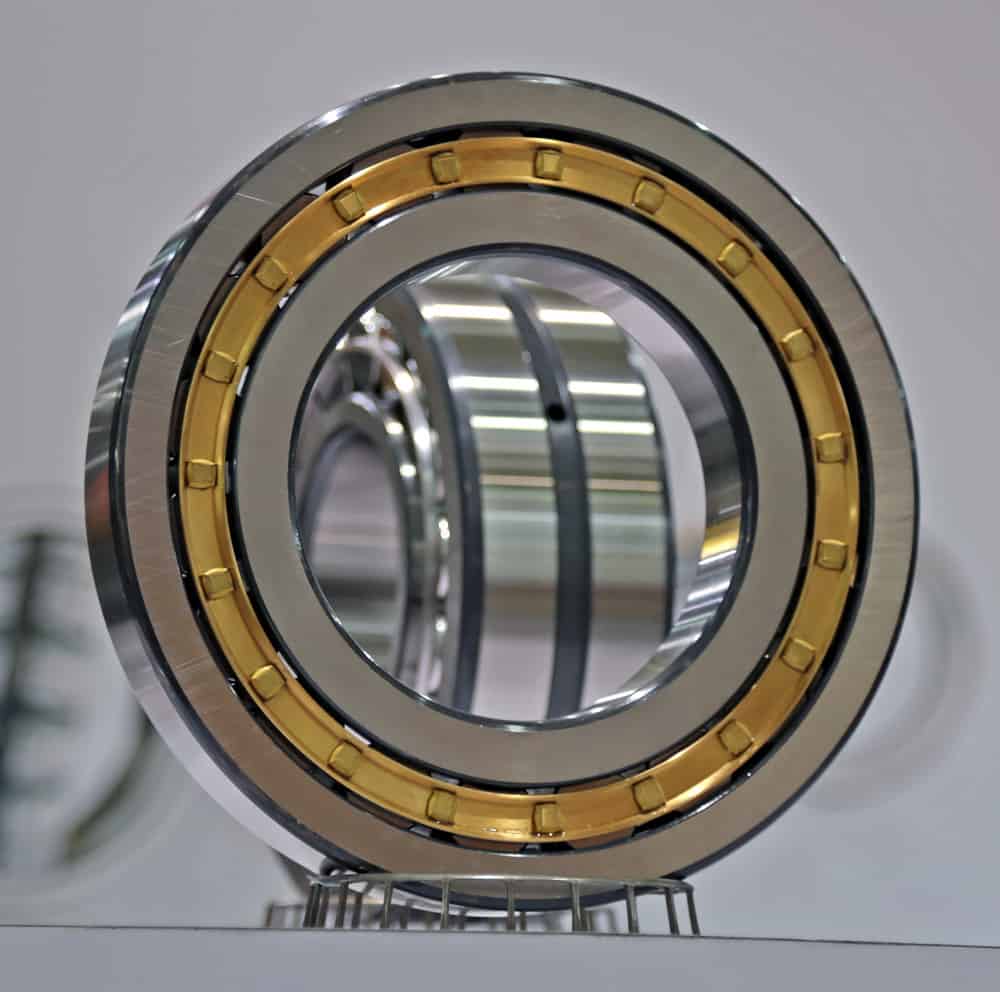 High-quality precision ball bearing featuring a gold accent ring, designed for durability and performance in various machinery applications.